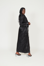 'Six figures' open abaya